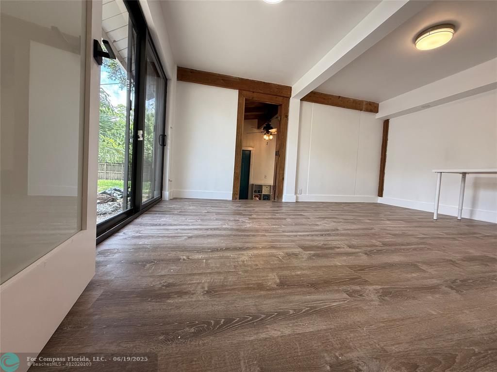 22990 Southwest 156th Avenue Miami, FL 33170 - Photo 19 of 41 a view of a livingroom with wooden floor