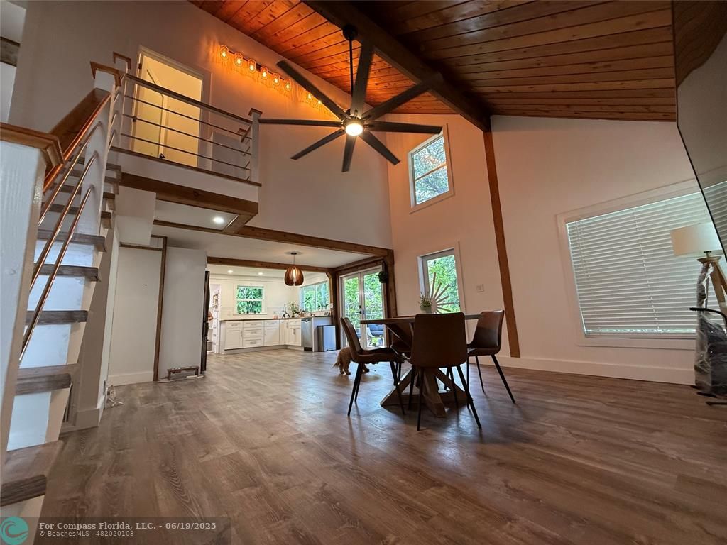 22990 Southwest 156th Avenue Miami, FL 33170 - Photo 20 of 41 a view of a patio with table and chairs and wooden floor