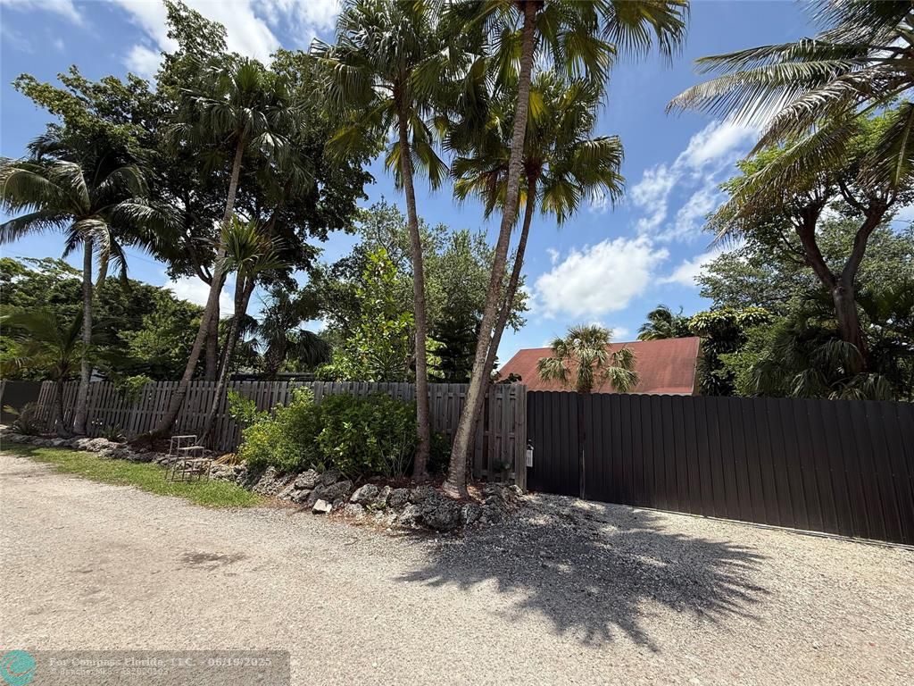 22990 Southwest 156th Avenue Miami, FL 33170 - Photo 2 of 41 a view of a house with a yard