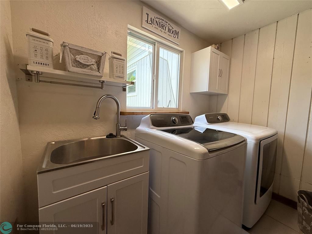 22990 Southwest 156th Avenue Miami, FL 33170 - Photo 22 of 41 a utility room with dryer and washer
