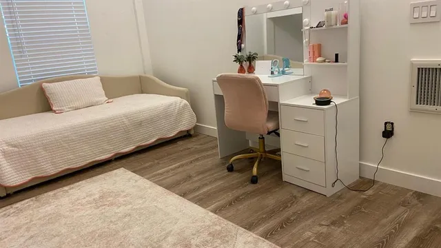 a bedroom with a bed and cabinets