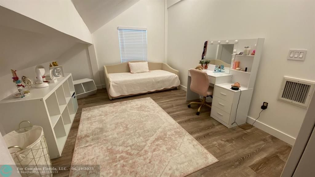 22990 Southwest 156th Avenue Miami, FL 33170 - Photo 29 of 41 a bedroom with a bed and wooden floor