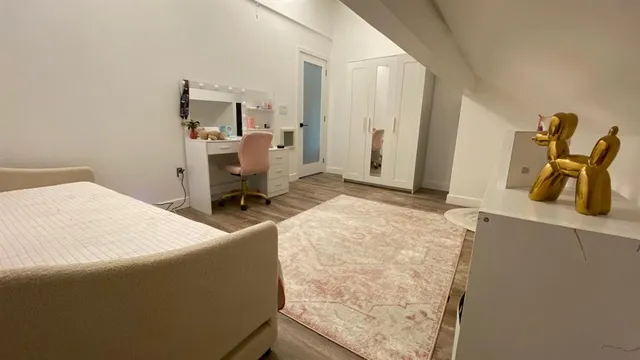 a bedroom with a bed and furniture