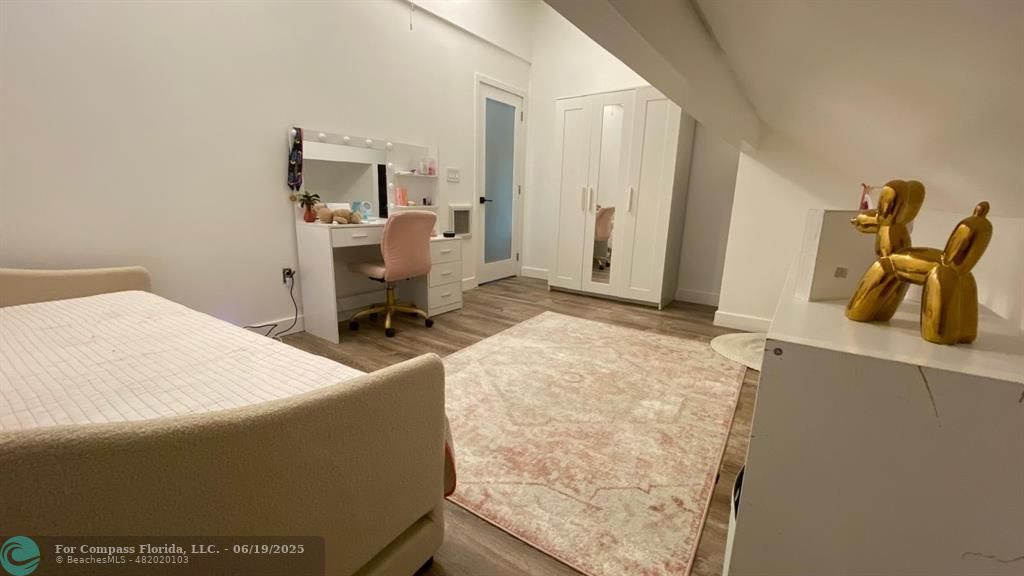 22990 Southwest 156th Avenue Miami, FL 33170 - Photo 31 of 41 a bedroom with a bed and furniture