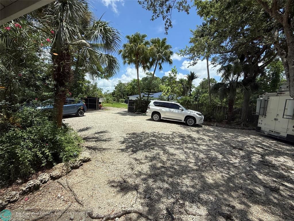 22990 Southwest 156th Avenue Miami, FL 33170 - Photo 38 of 41 a car parked in front of house