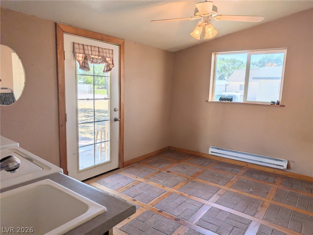 997 Phillips Street Panaca, NV 89042 - Photo 15 of 19 A quaint space with textured flooring and a view to a private yard, ready for personalized touches.