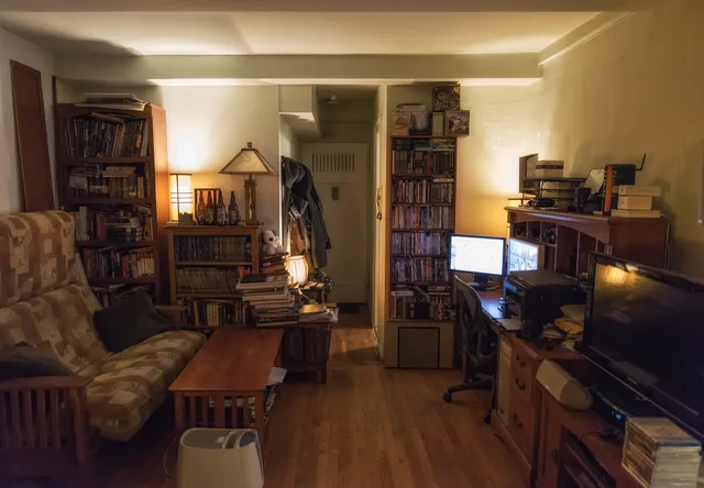 a living room with lots of furniture and entryway
