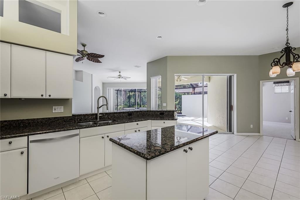10221 Cape Roman Road, Unit 102 Estero, FL 34135 - Photo 12 of 49 Island Kitchen with Pantry & Breakfast Bar