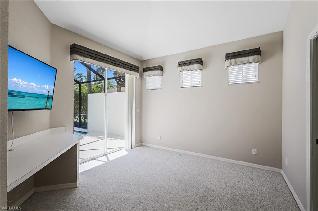 10221 Cape Roman Road, Unit 102 Estero, FL 34135 - Photo 17 of 49 Bedroom 3 or Den w/ Pool View & Entrance to Jack & Jill Bathroom
