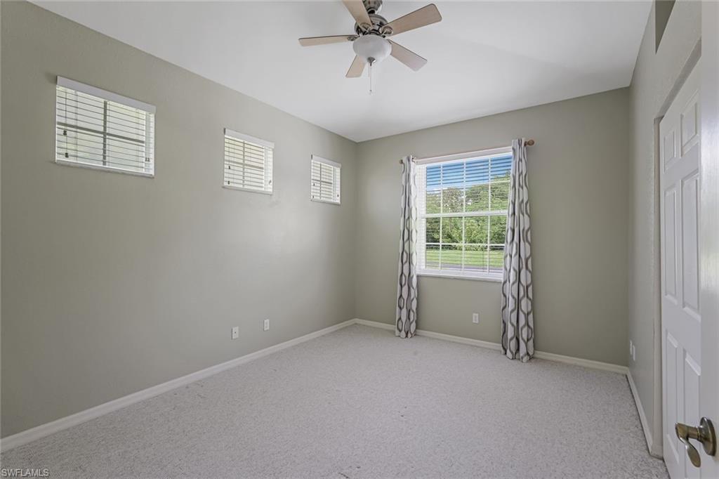 10221 Cape Roman Road, Unit 102 Estero, FL 34135 - Photo 19 of 49 Bed 2 With View of Front Yard