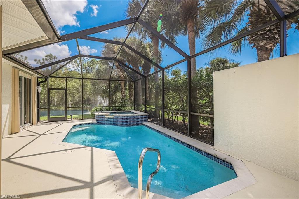 10221 Cape Roman Road, Unit 102 Estero, FL 34135 - Photo 21 of 49 Screened Lanai with Pool/Spa - Very Private Lake View