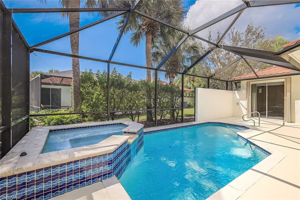 10221 Cape Roman Road, Unit 102 Estero, FL 34135 - Photo 23 of 49 Screened Lanai with Pool/Spa - Very Private Lake View with Water Feature