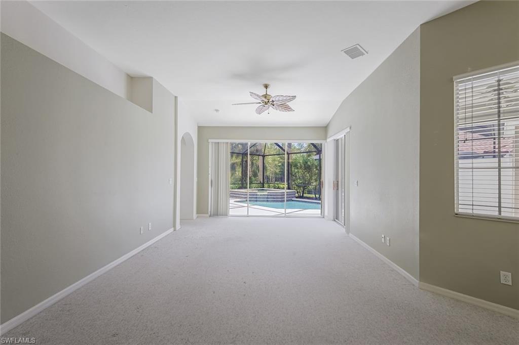 10221 Cape Roman Road, Unit 102 Estero, FL 34135 - Photo 6 of 49 Living Room Pool View