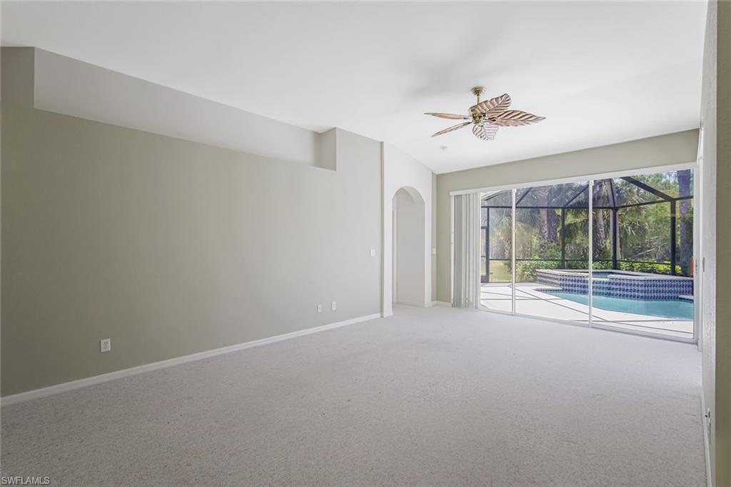 10221 Cape Roman Road, Unit 102 Estero, FL 34135 - Photo 7 of 49 Living Room Pool View