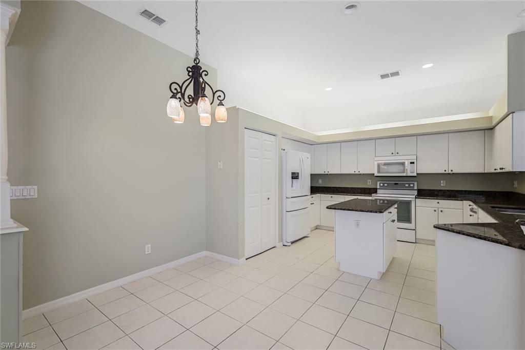 10221 Cape Roman Road, Unit 102 Estero, FL 34135 - Photo 9 of 49 Kitchen with Breakfast Room