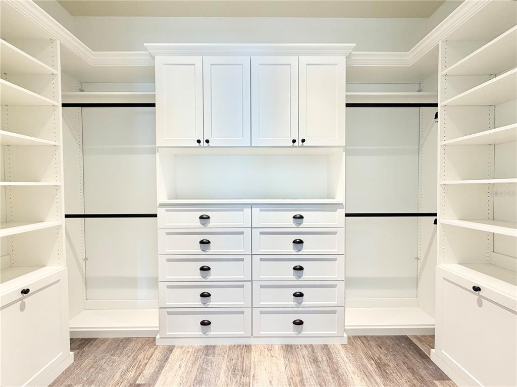 5243 West Lake Butler Road Windermere, FL 34786 - Photo 21 of 43 a view of walk in closet with empty racks