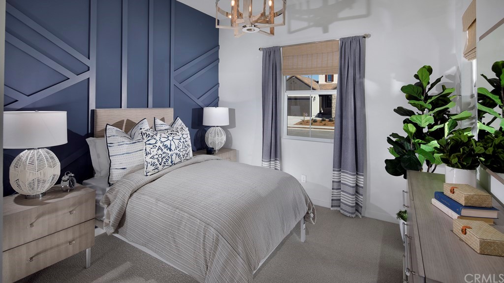 32034 Sedge Way Temecula, CA 92591 - Photo 2 of 14 a bedroom with a bed and a potted plant