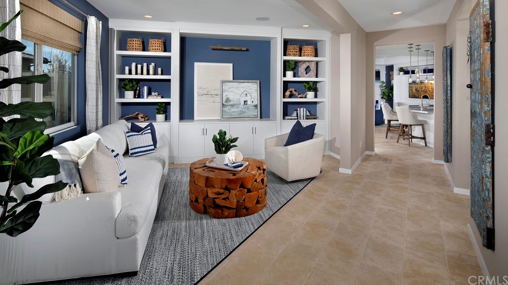 32034 Sedge Way Temecula, CA 92591 - Photo 7 of 14 a living room with furniture and book shelf