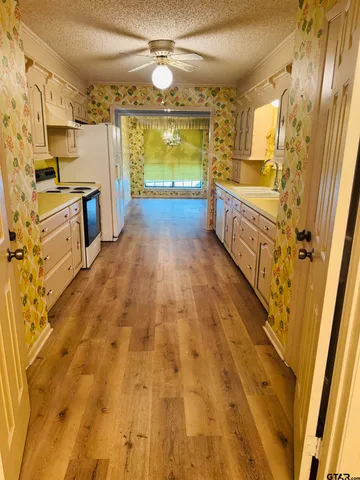 a bathroom with a sink a mirror and shower