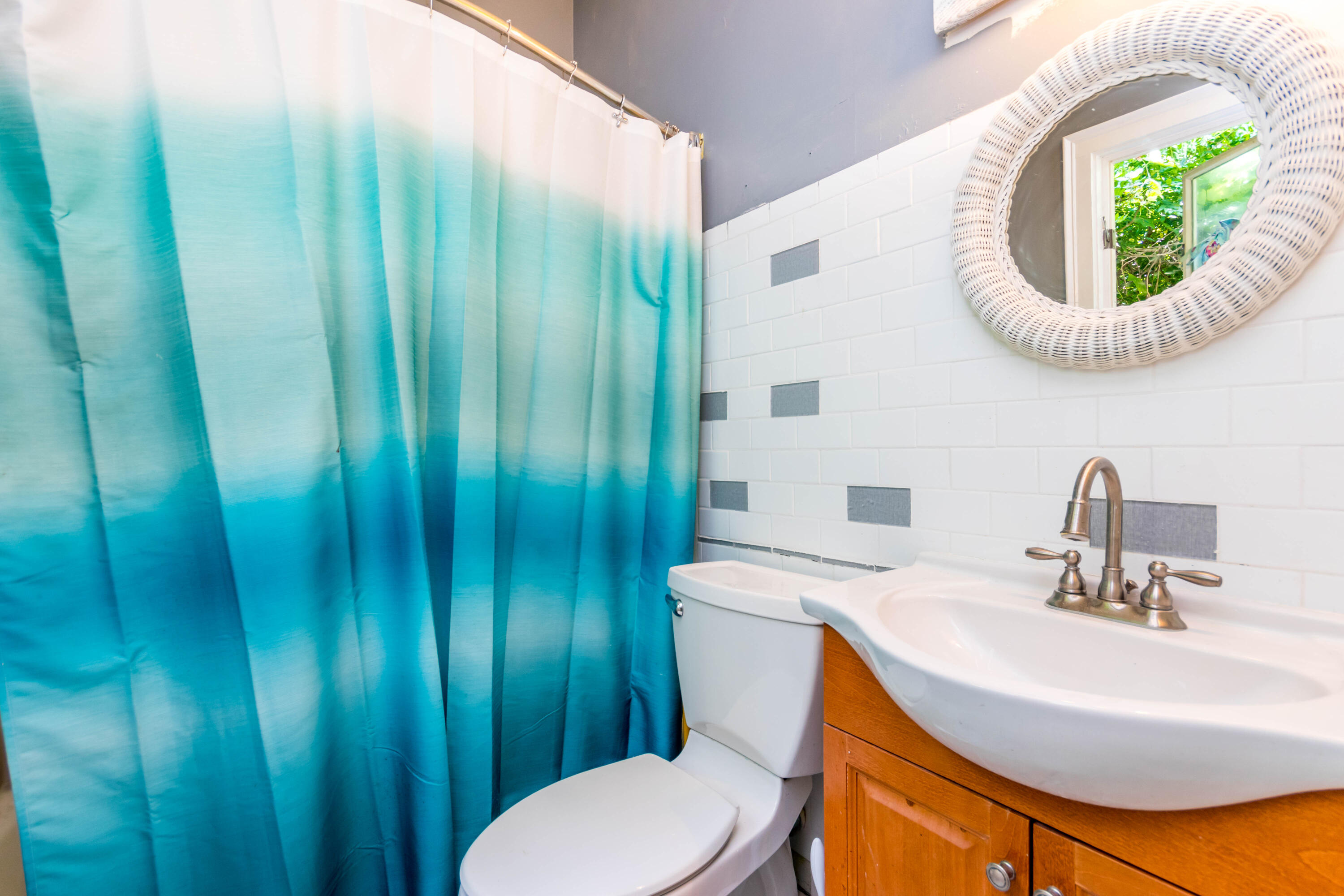 305 County Road Monument Beach, MA 02532 - Photo 18 of 34 a bathroom with a sink and a mirror