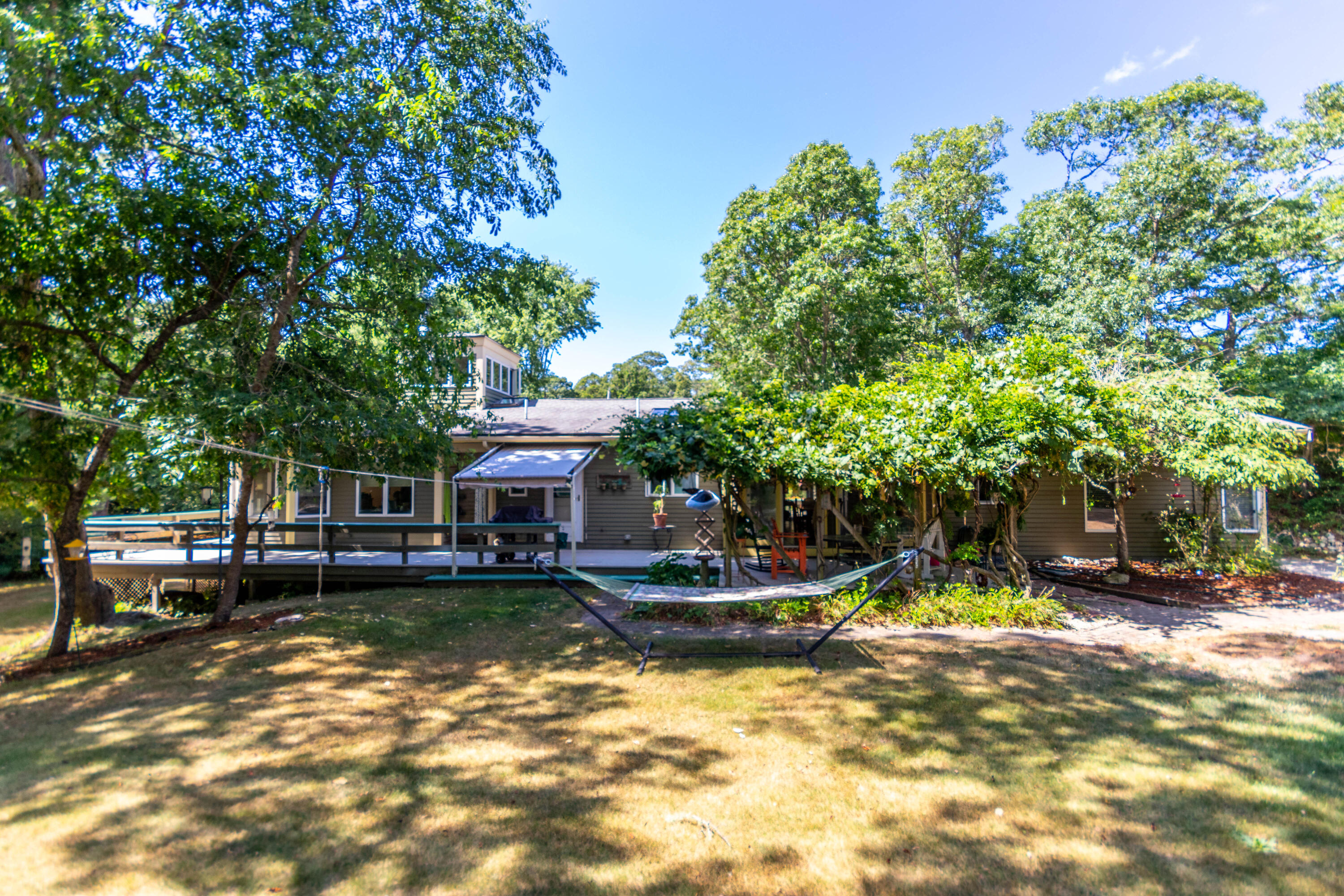 305 County Road Monument Beach, MA 02532 - Photo 2 of 34 a view of a house with swimming pool and a yard