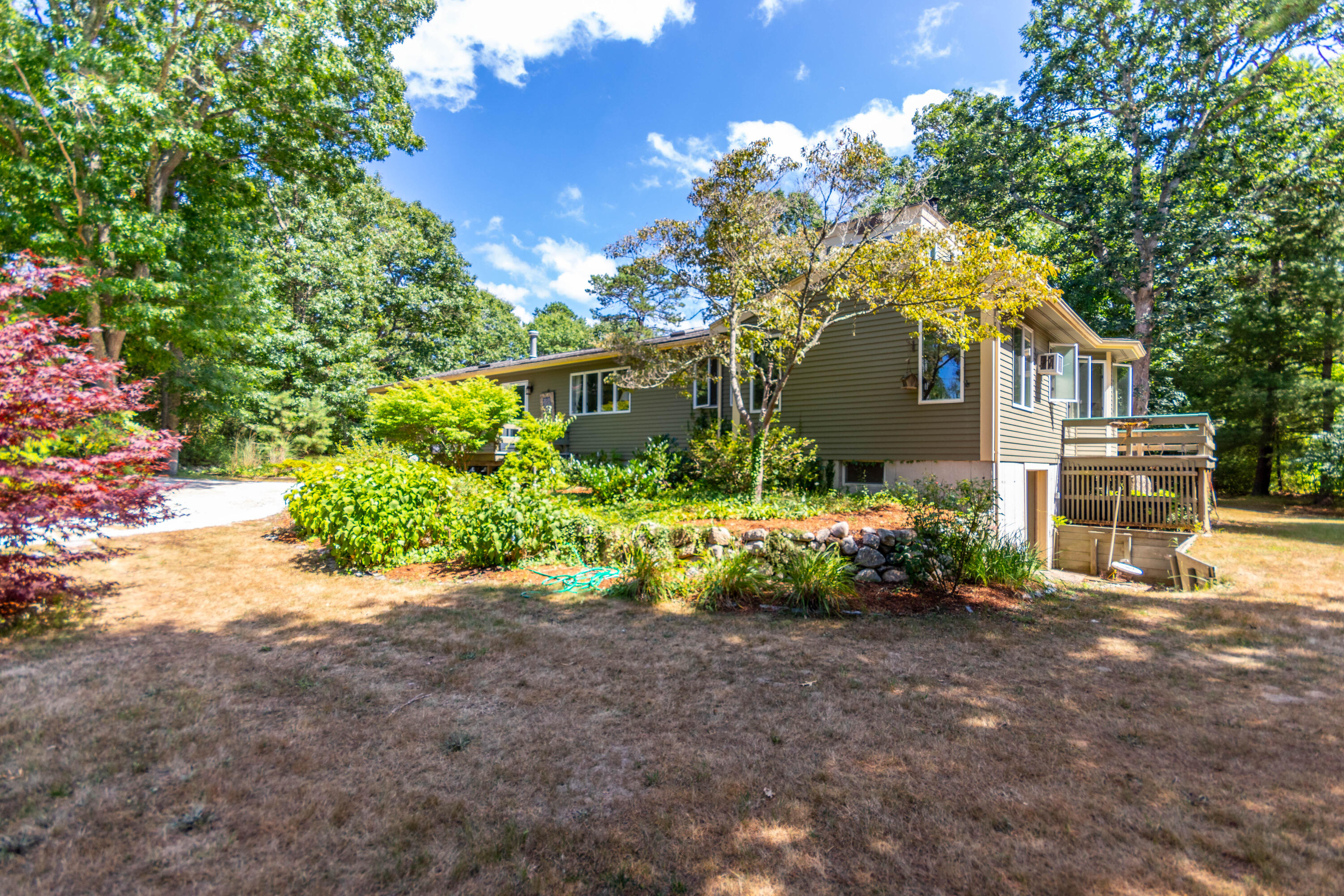 305 County Road Monument Beach, MA 02532 - Photo 25 of 34 a front view of a house with garden