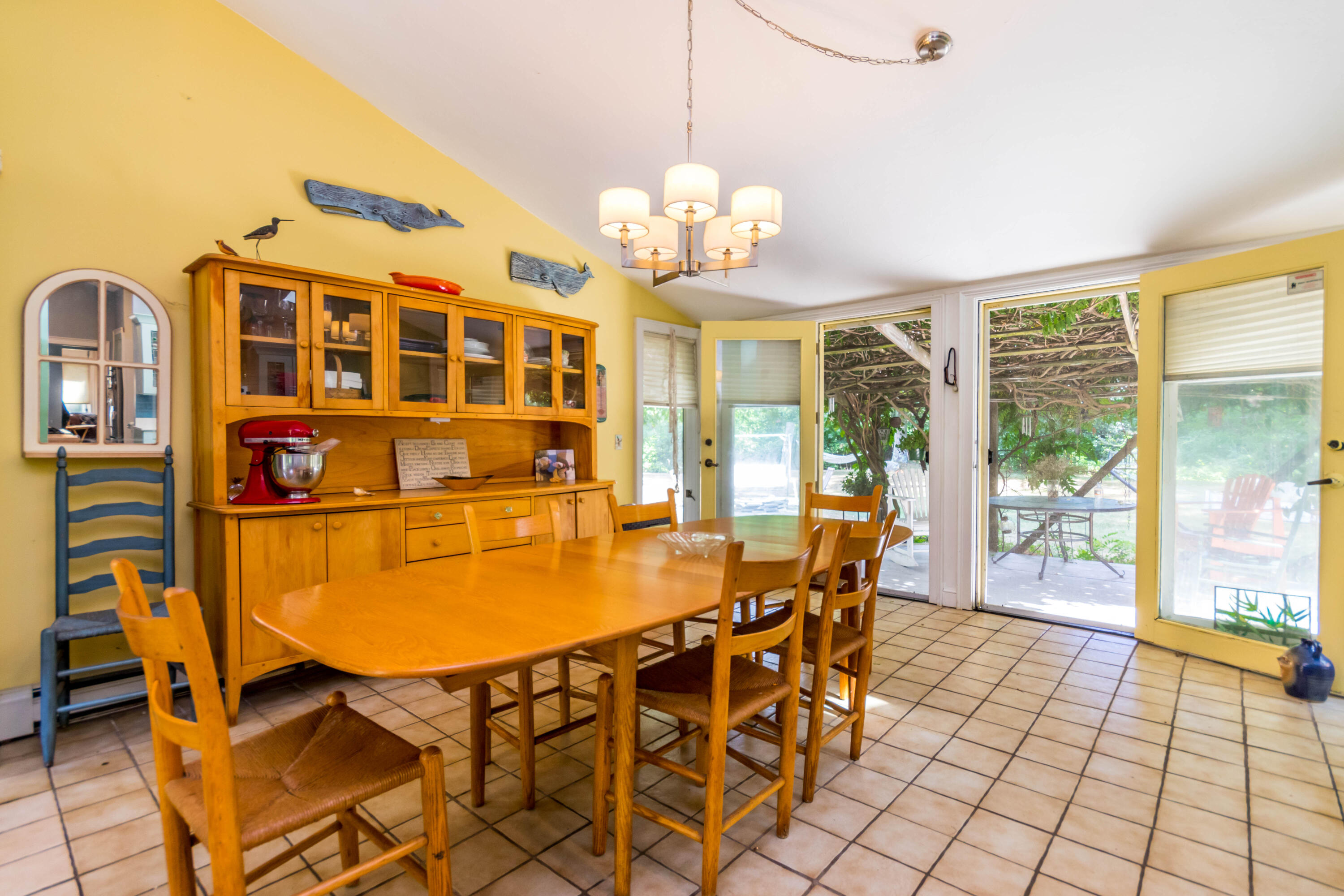 305 County Road Monument Beach, MA 02532 - Photo 9 of 34 a view of a dining room with furniture and a chandelier