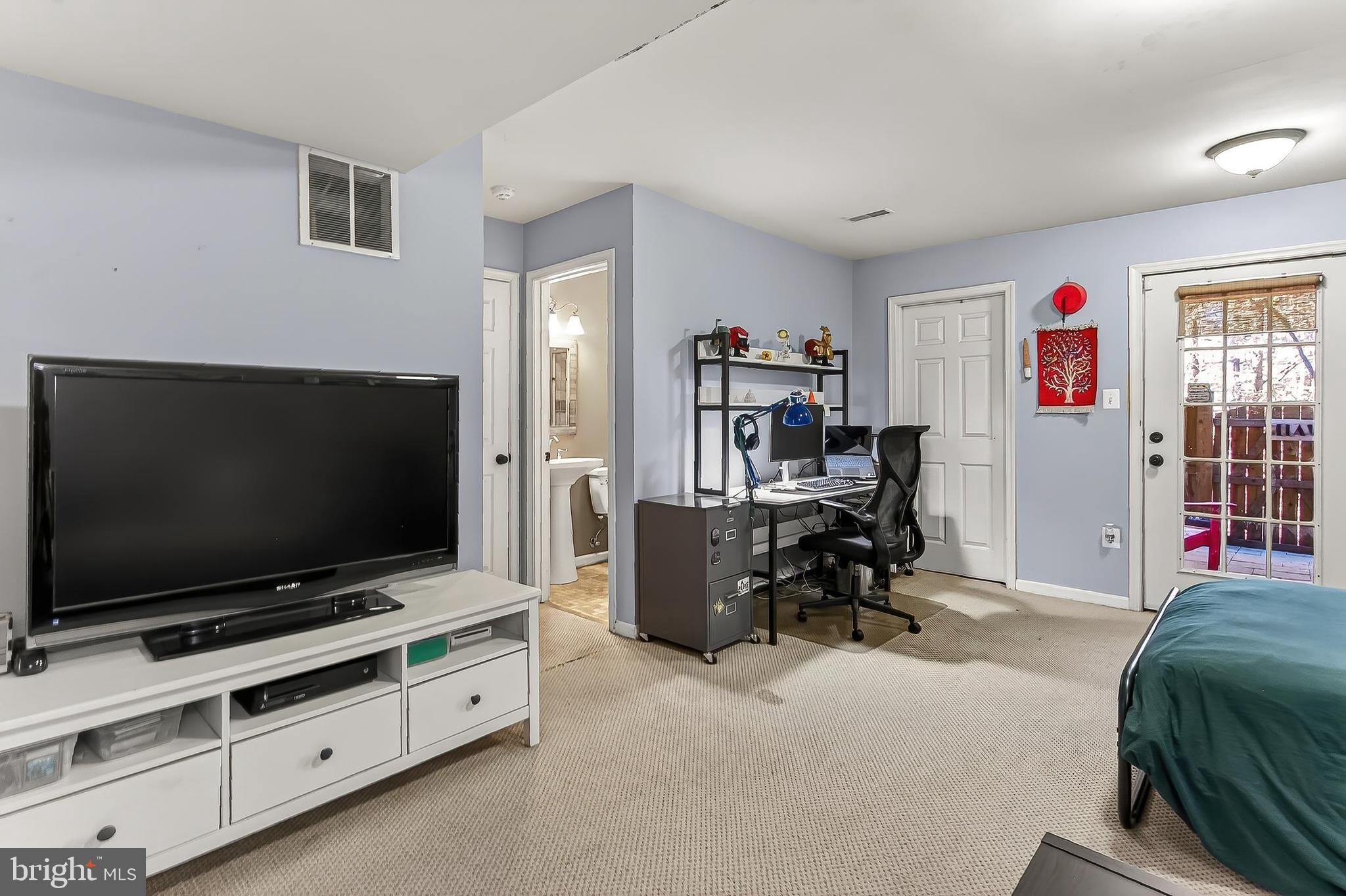 8445 Carmela Circle Springfield, VA 22153 - Photo 11 of 53 a living room with furniture and a flat screen tv