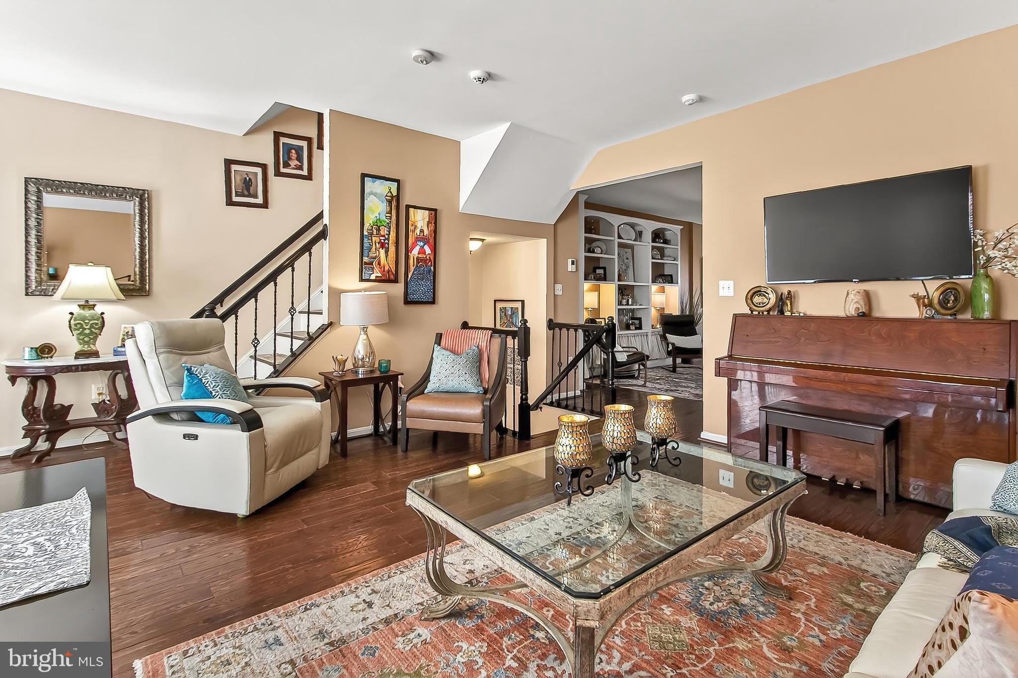 8445 Carmela Circle Springfield, VA 22153 - Photo 19 of 53 a living room with furniture and a flat screen tv