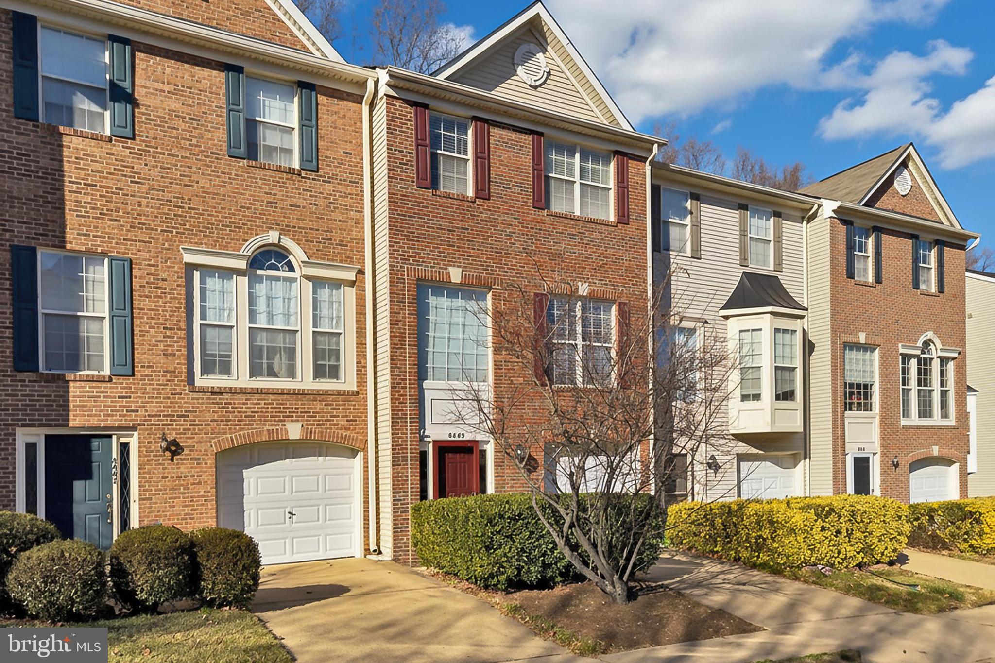 8445 Carmela Circle Springfield, VA 22153 - Photo 2 of 53 a front view of a house with a yard