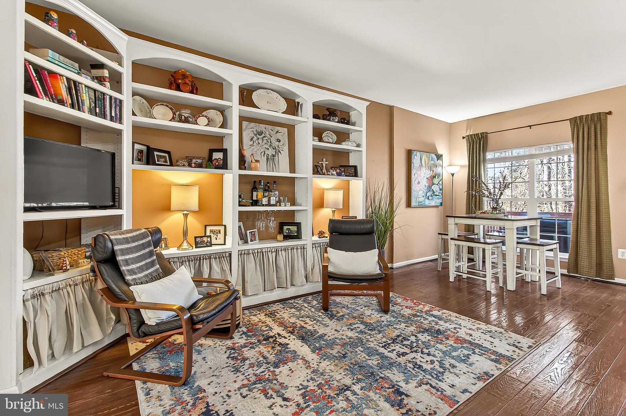 8445 Carmela Circle Springfield, VA 22153 - Photo 21 of 53 a living room with furniture a rug and a window