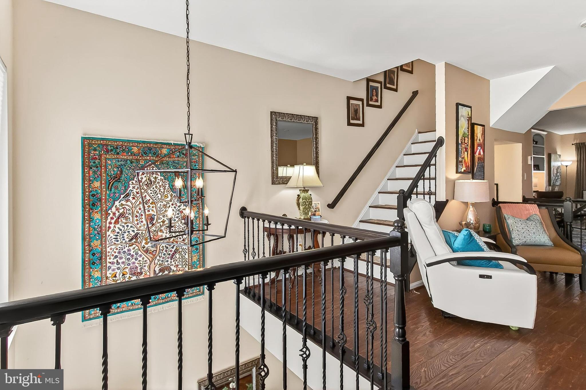8445 Carmela Circle Springfield, VA 22153 - Photo 38 of 53 a view of staircase with furniture and wooden floor