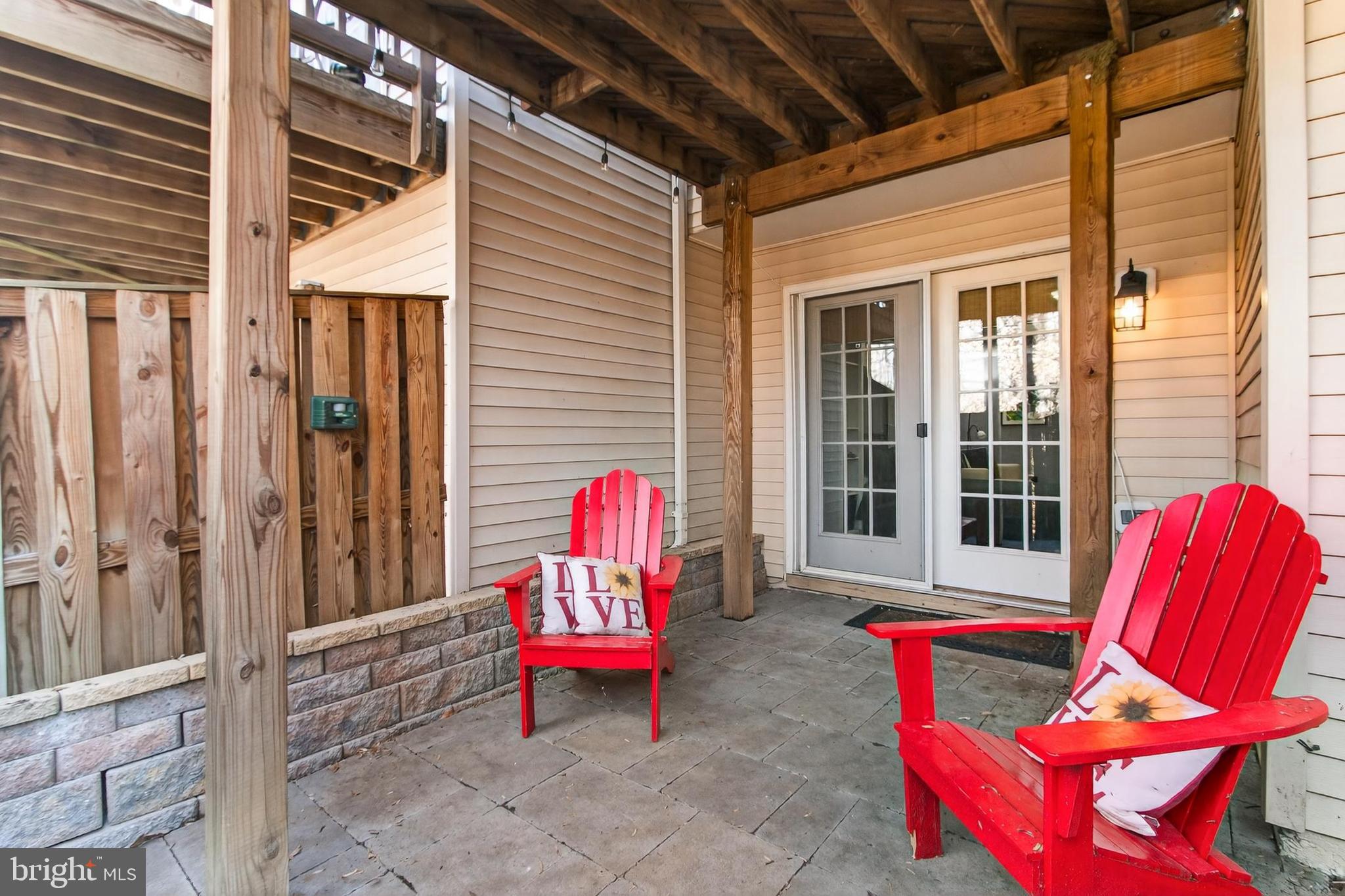 8445 Carmela Circle Springfield, VA 22153 - Photo 8 of 53 a backyard of a house with seating space and sitting space