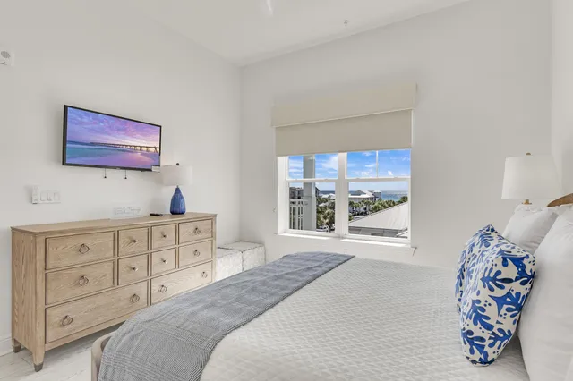 a bedroom with a bed and a night stand