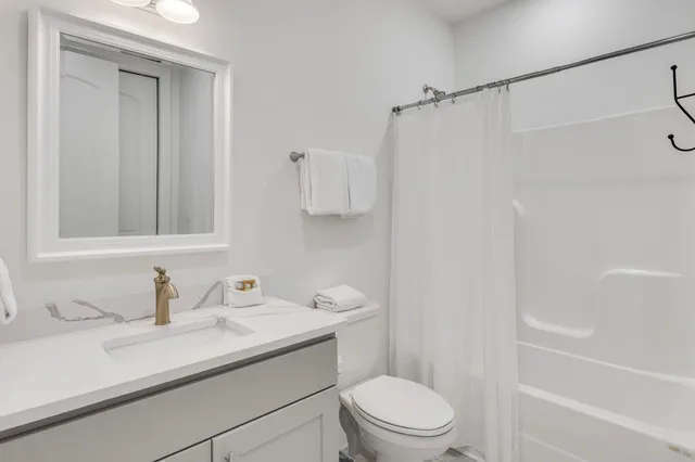 a room with a bed and a window