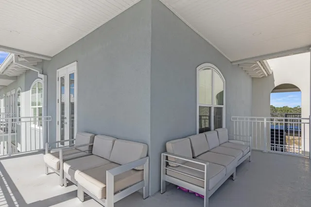 a view of a swimming pool with outdoor seating