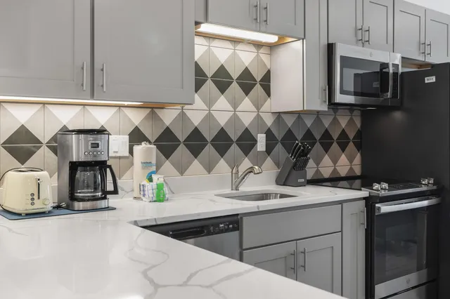 a bedroom with a large bed and a large window