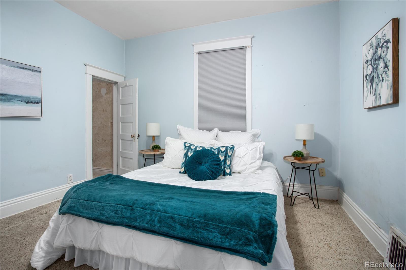 3777 Stuart Street Denver, CO 80212 - Photo 22 of 40 a bedroom with a bed and painting on the wall