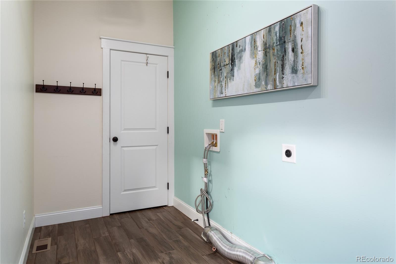 3777 Stuart Street Denver, CO 80212 - Photo 25 of 40 a view of a hallway with wooden floor