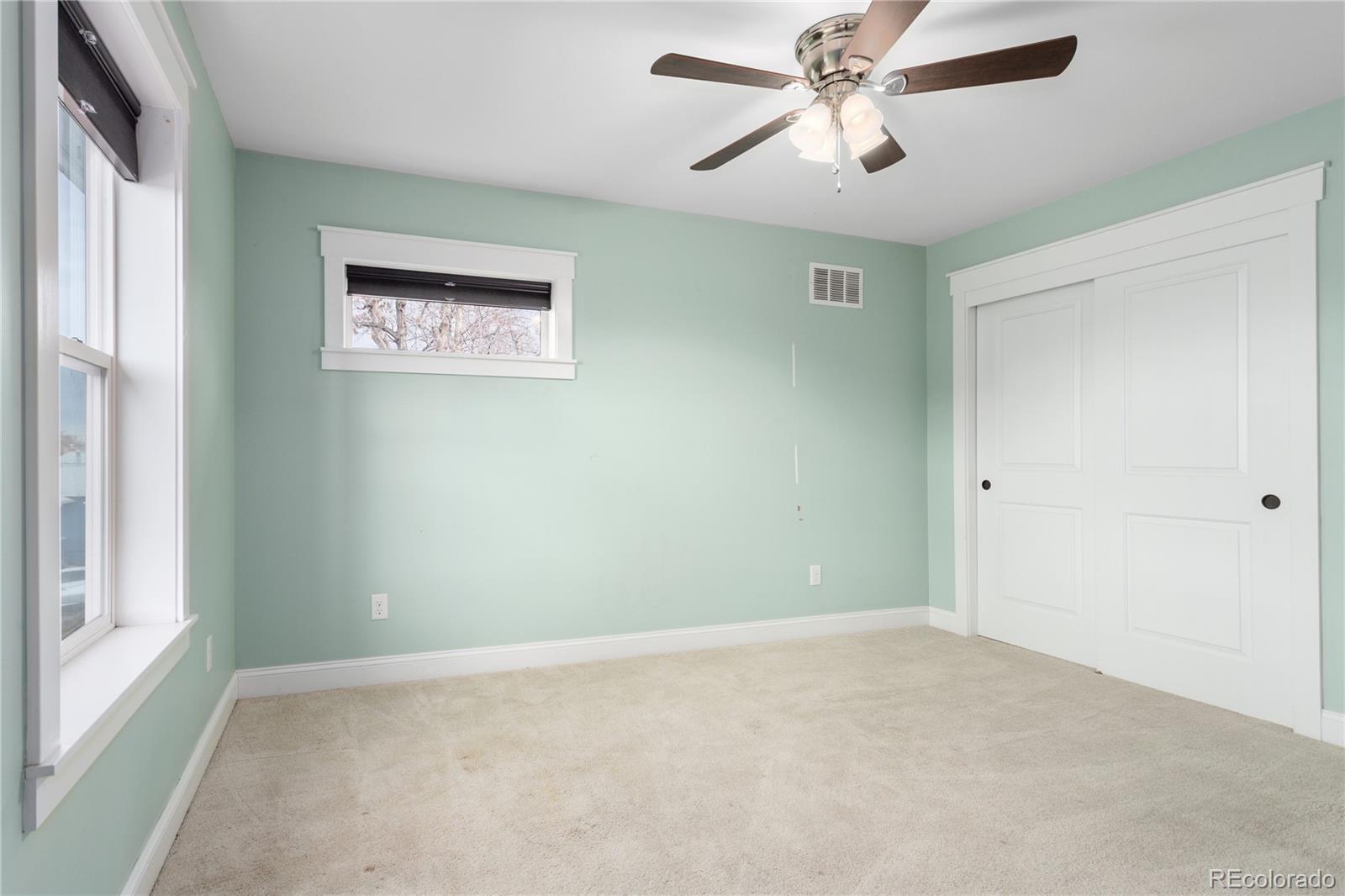 3777 Stuart Street Denver, CO 80212 - Photo 26 of 40 an empty room with windows and fan