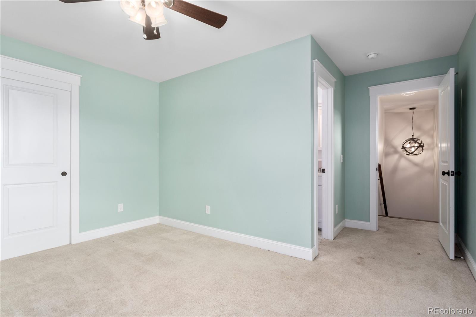 3777 Stuart Street Denver, CO 80212 - Photo 27 of 40 an empty room with closet and a chandelier fan
