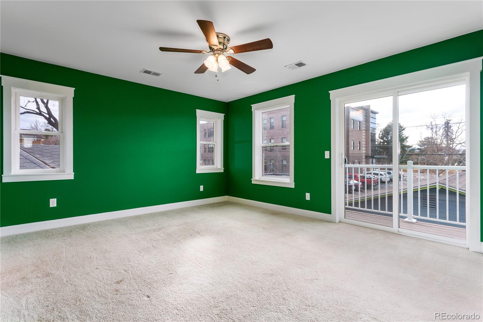 3777 Stuart Street Denver, CO 80212 - Photo 29 of 40 a view of a livingroom with a ceiling fan and window