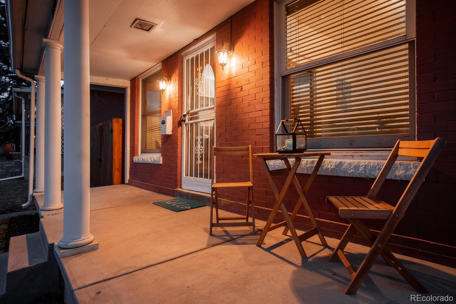 3777 Stuart Street Denver, CO 80212 - Photo 3 of 40 a balcony with table and chairs