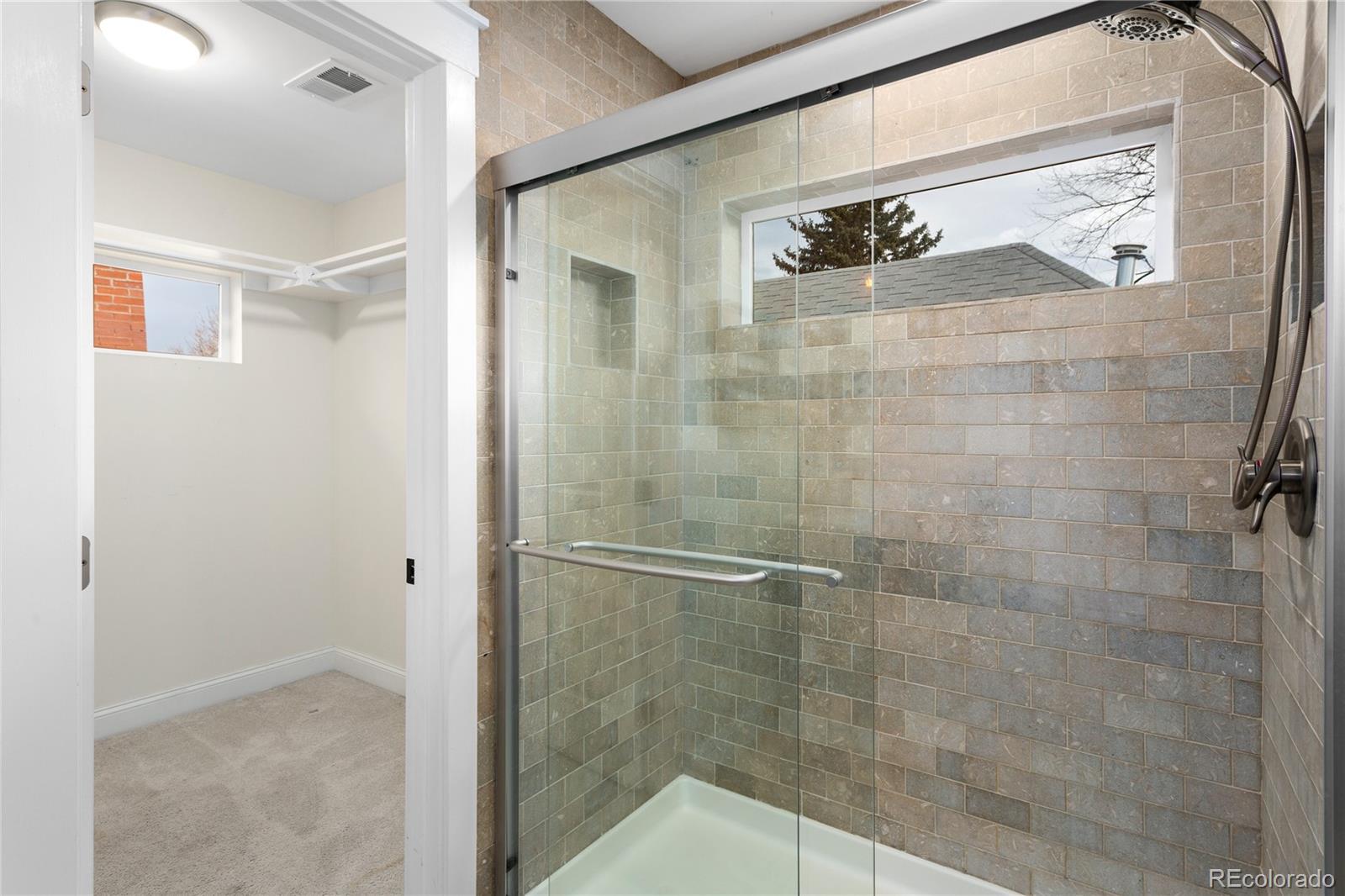 3777 Stuart Street Denver, CO 80212 - Photo 33 of 40 a bathroom with a shower