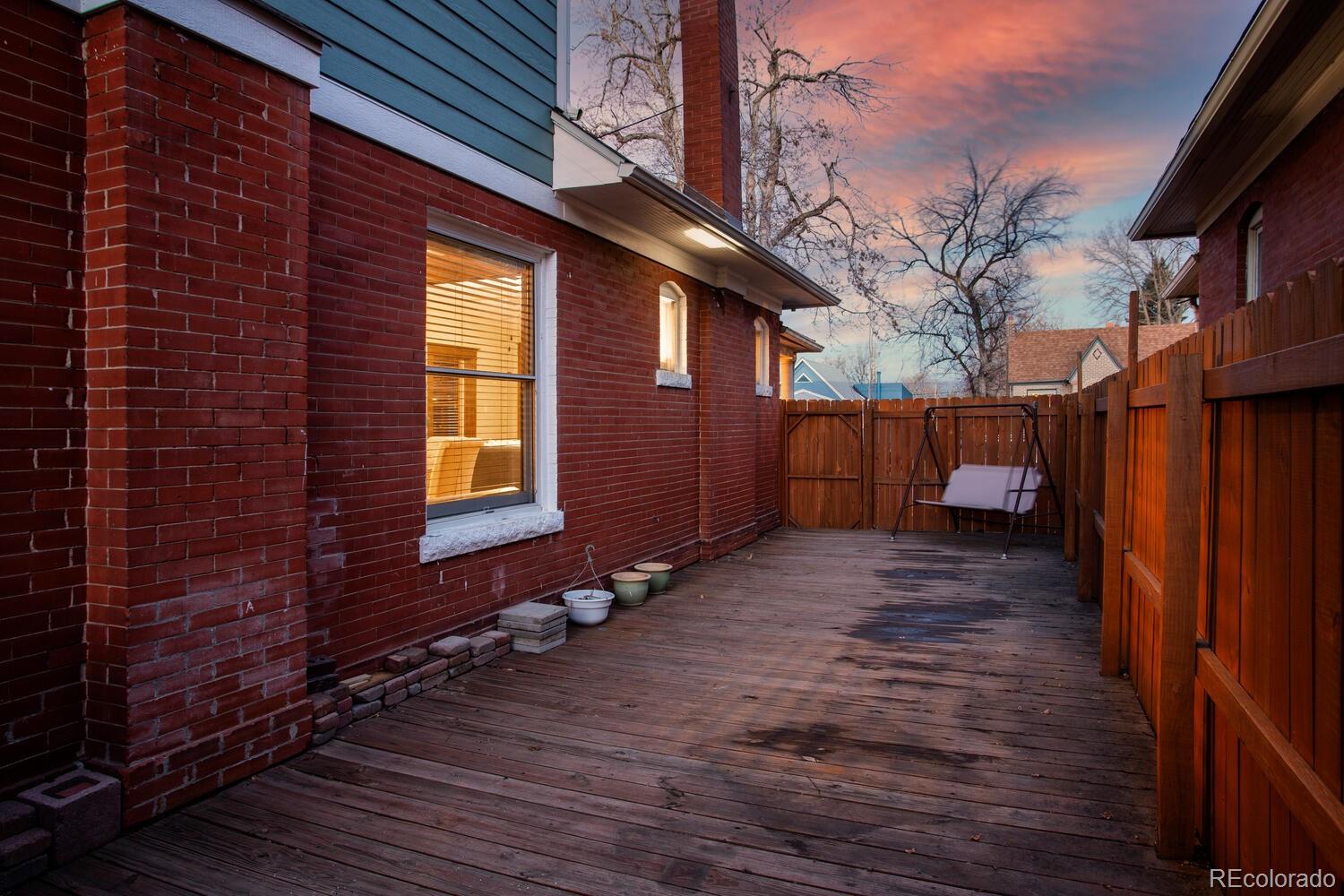 3777 Stuart Street Denver, CO 80212 - Photo 36 of 40 a view of a house with a backyard