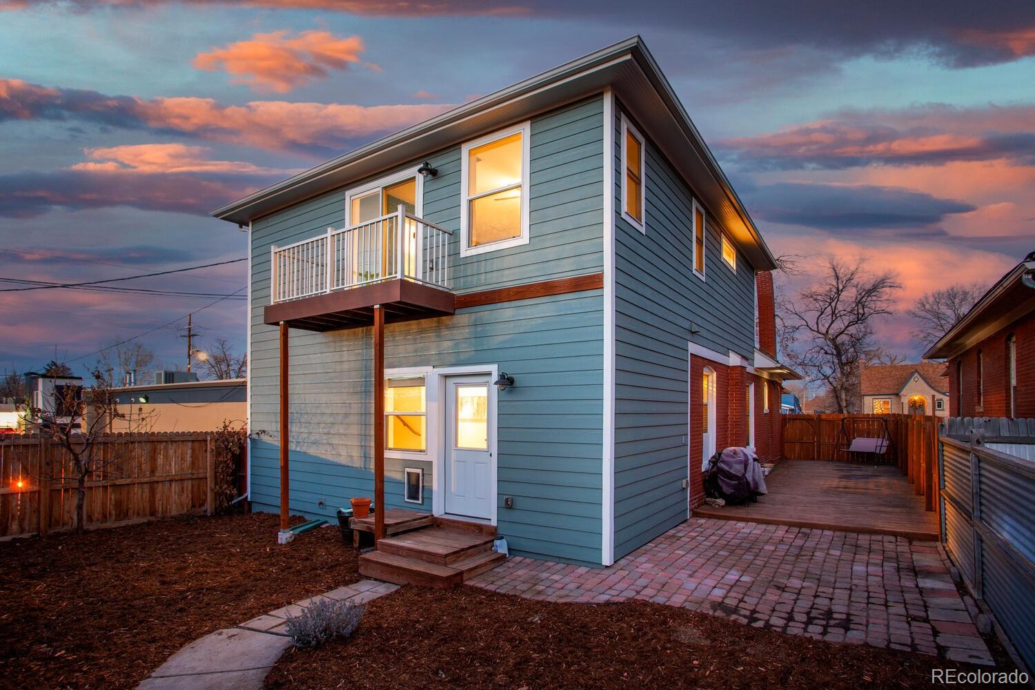 3777 Stuart Street Denver, CO 80212 - Photo 37 of 40 a view of a house with a yard