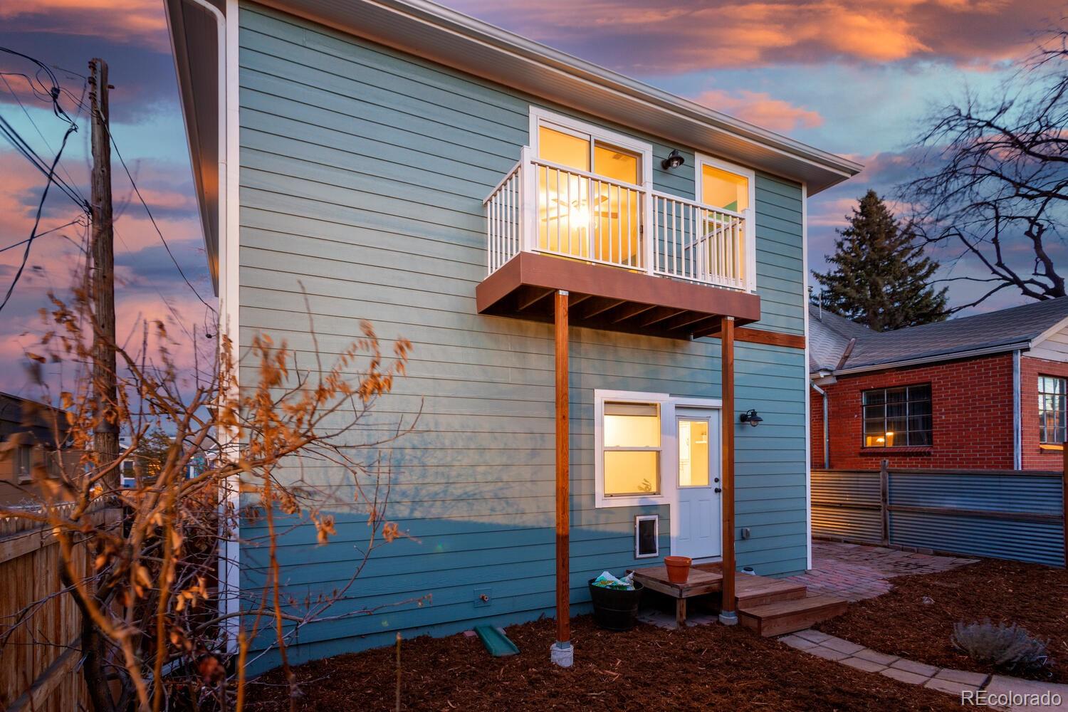 3777 Stuart Street Denver, CO 80212 - Photo 38 of 40 a backyard of a house with barbeque oven table and chairs