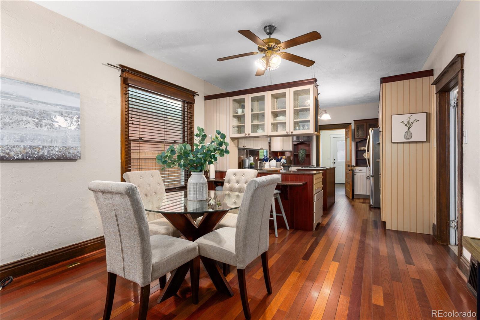 3777 Stuart Street Denver, CO 80212 - Photo 10 of 40 a view of a dining room with furniture window and wooden floor