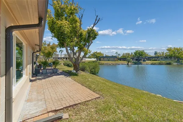 a view of a lake with a house in the background