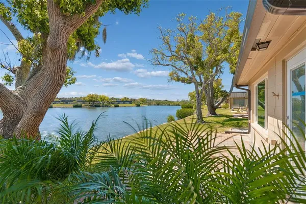 a view of a backyard of the house